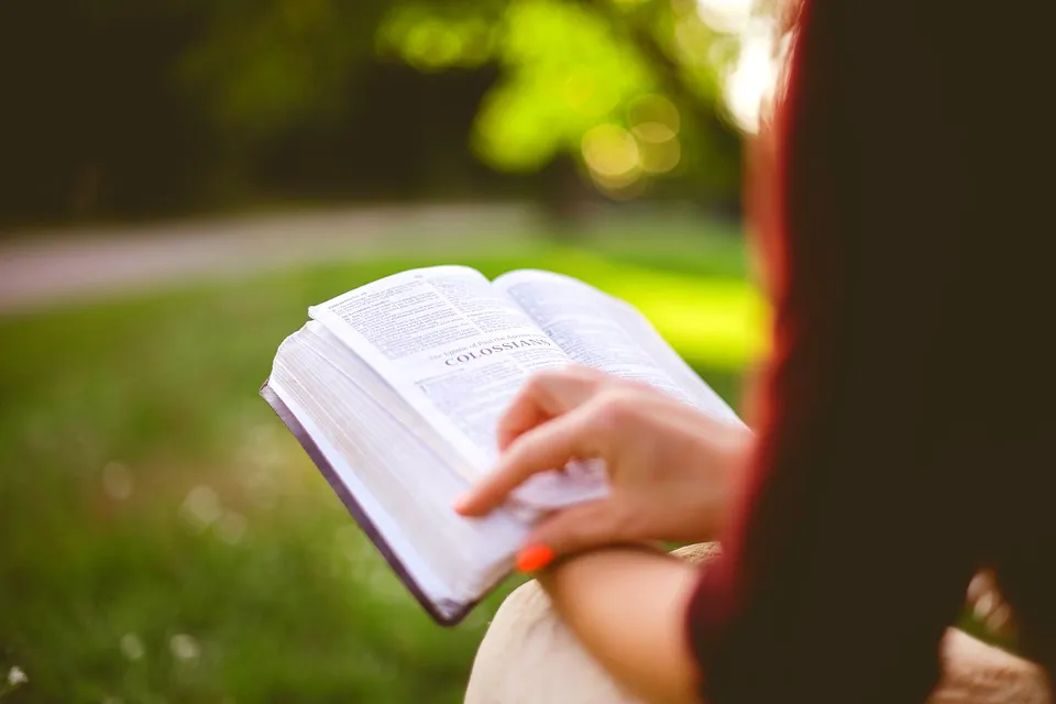 Girl Reading Bible Closeup