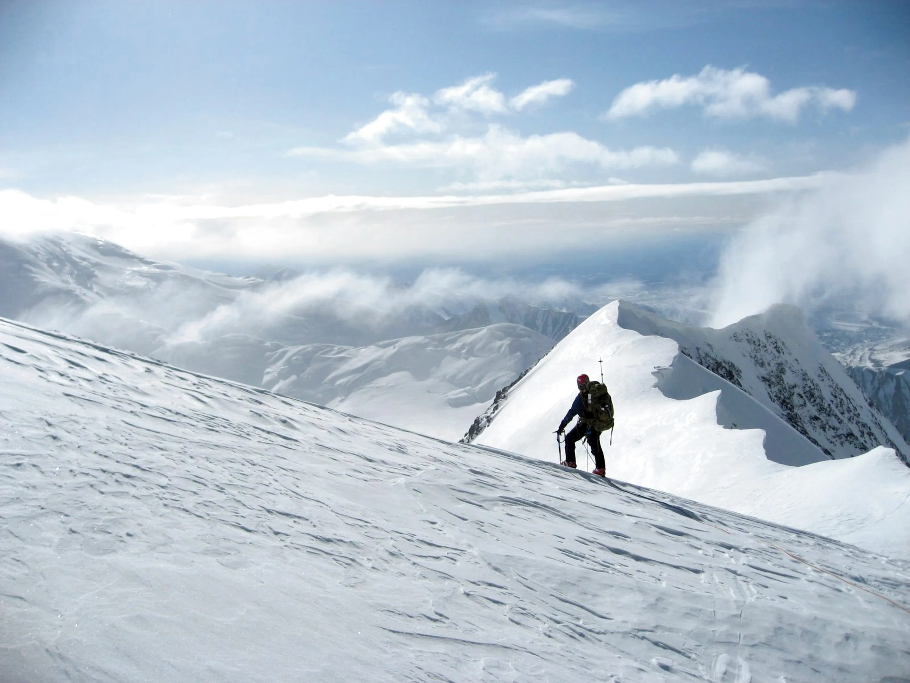 Man Climbing Mountain