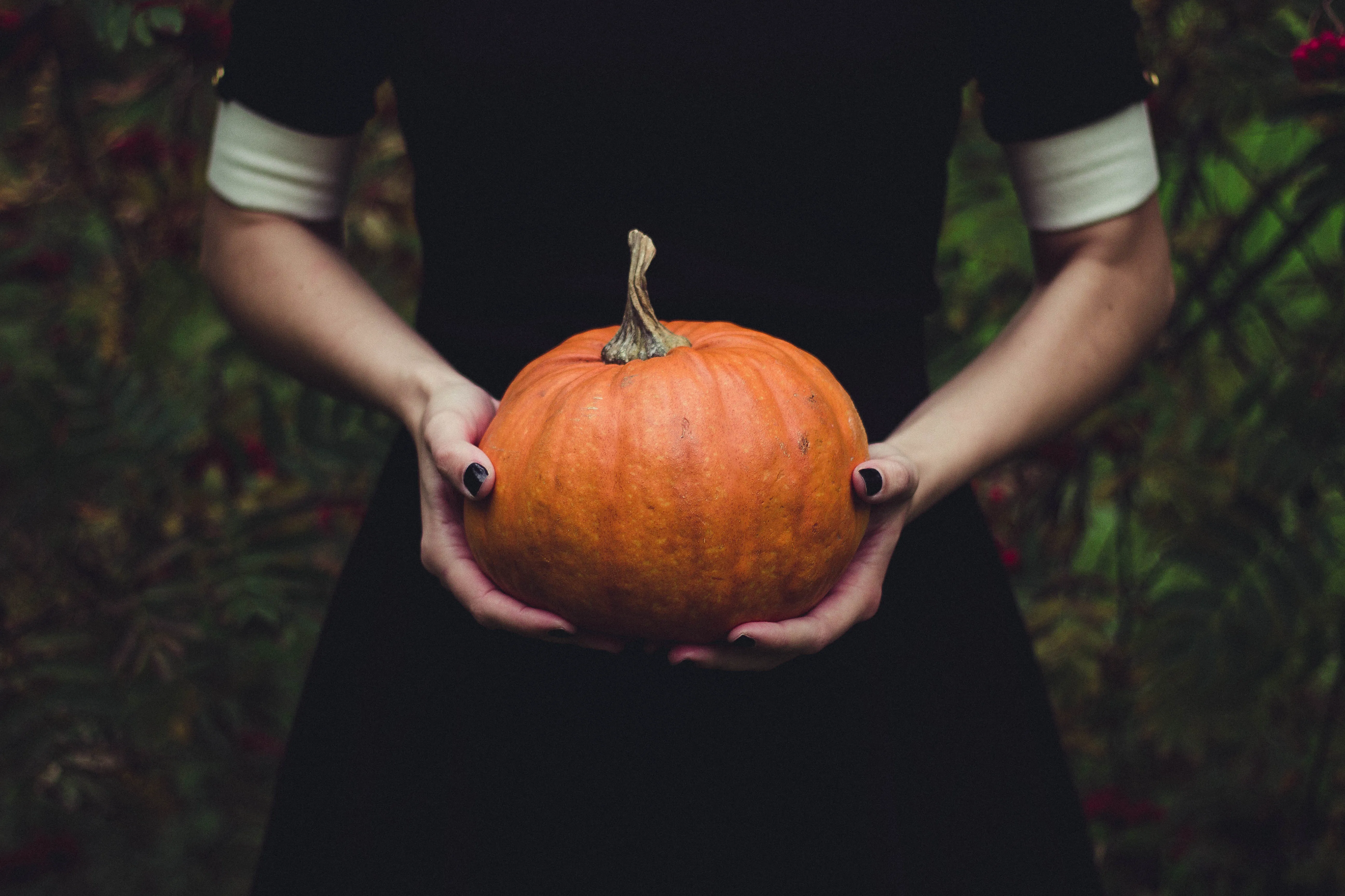 Woman Holding Pumpkin